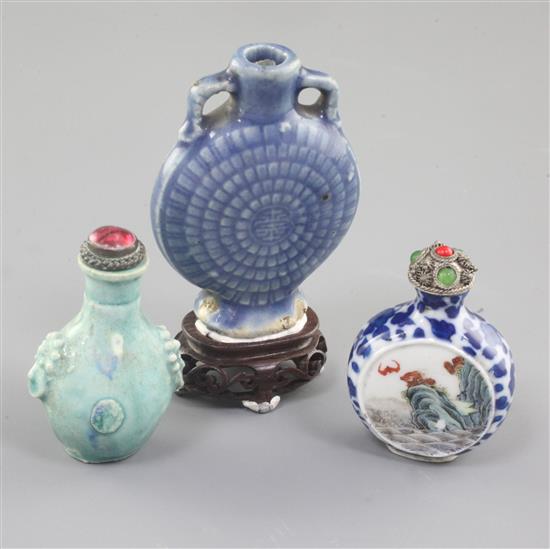 Three Chinese porcelain snuff bottles, 19th / early 20th century, 4.3cm - 7cm excluding stoppers and stands